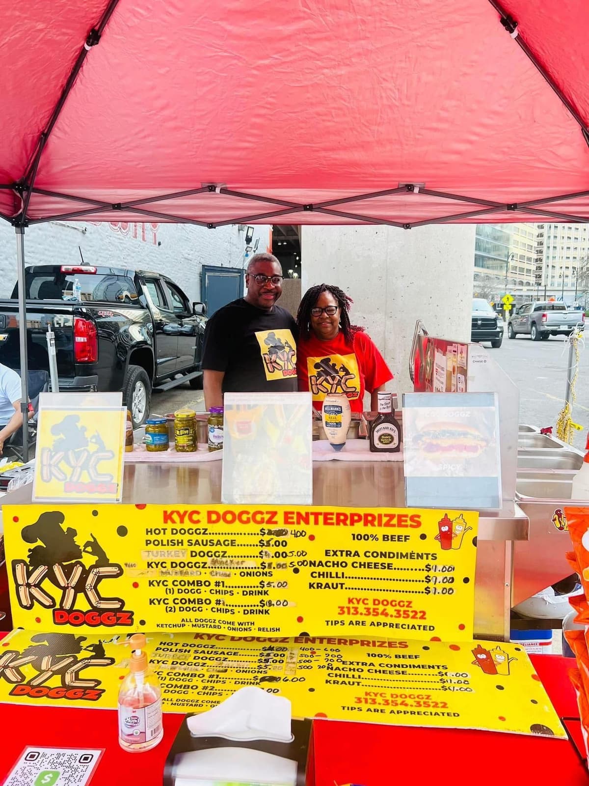 The Cannadys at the full KYC Doggz Enterprizes stand in downtown Detroit