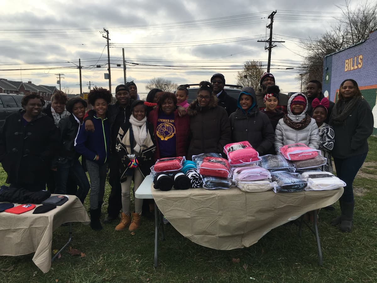 Generous Giving Detroit team with blankets and supplies for the community