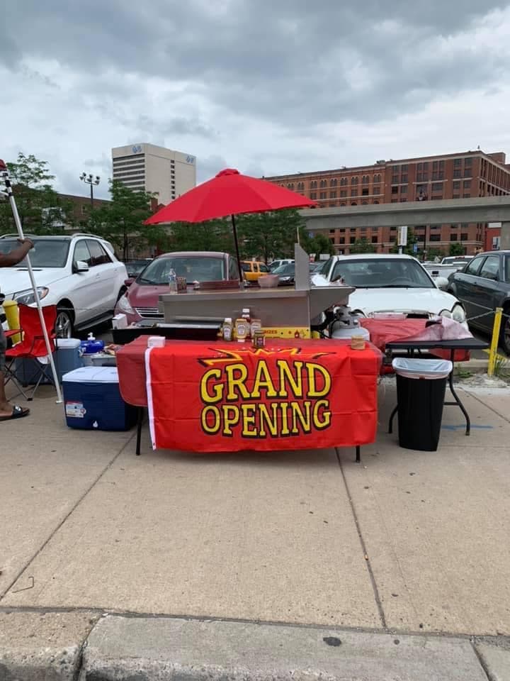 KYC Doggz grand opening — hot dog cart setup in downtown Detroit