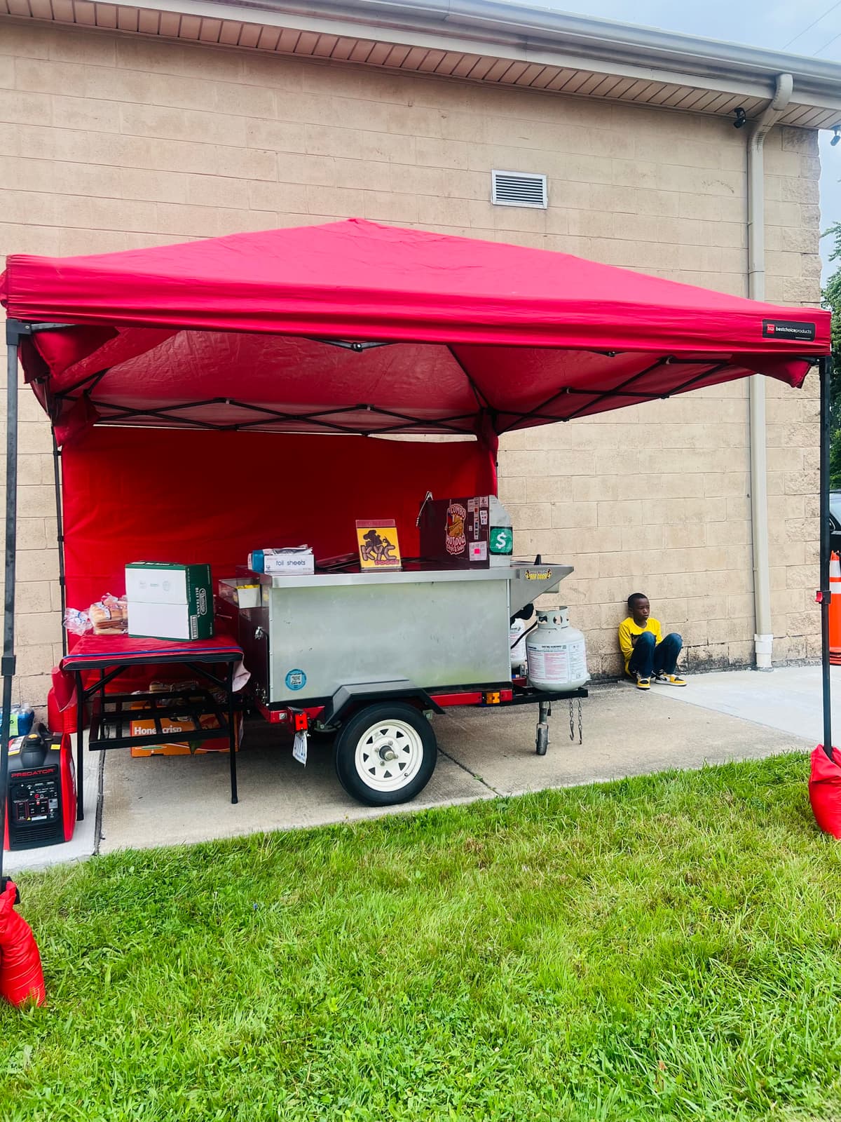 Cart under the red tent at a church event