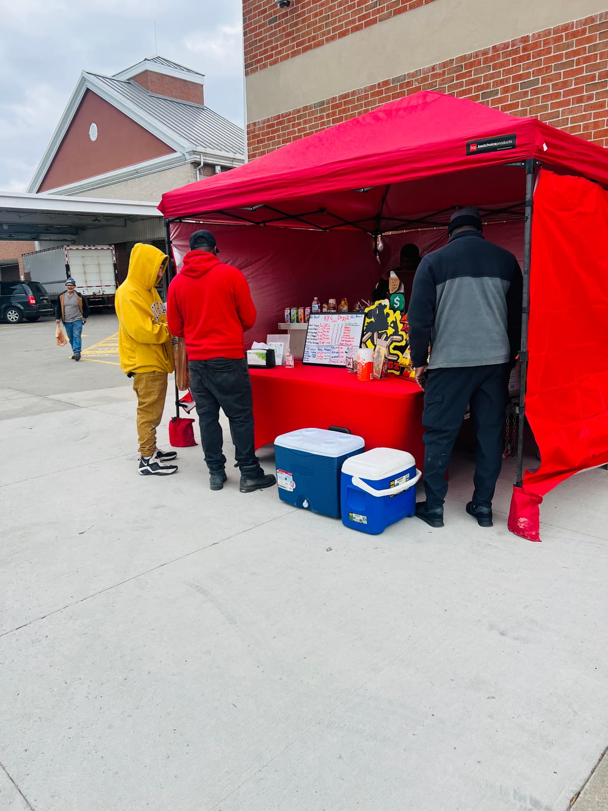 Customers ordering at the KYC Doggz red tent